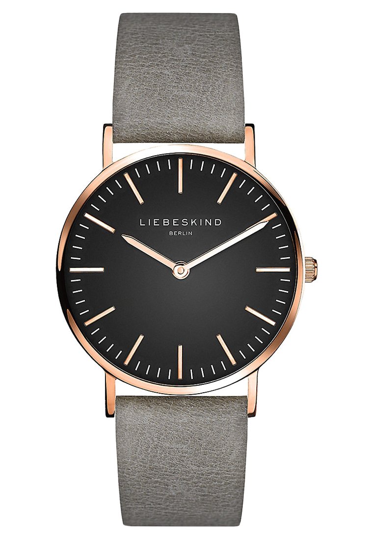 Analoge Uhr mit schwarzem Zifferblatt, goldenen Zeigern und Markierungen sowie einem grauen Lederarmband. Runder Gehäuse mit minimalistischem Design und Markenlogo.