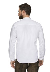 Weißes Langarmshirt mit geknöpftem Bund, abgerundetem Saum und schlichter Gestaltung. Die Rückseite ist sauber verarbeitet und weist ein dezentes Yoke-Detail auf.