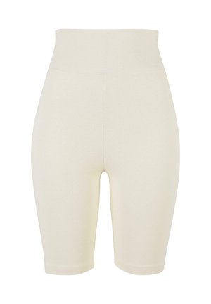 Beige kompresjonsshorts laget av et mykt, elastisk stoff med høy midje, med en jevn tekstur og en tettsittende design.