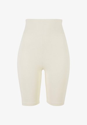 Beige kompressziós rövidnadrág, puha, rugalmas anyagból készült, magas derékkal, sima textúrával és testhez álló fazonnal.