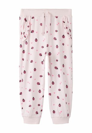 Jasnoróżowe spodnie dla malucha z elastycznymi mankietami, ściągaczem w talii, falbankami przy bocznych kieszeniach, ozdobione nadrukiem małych różowych biedronek i serduszek.