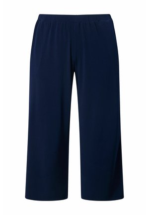 Tmavě modré široké kalhoty do poloviny lýtek s elastickým pasem, vyrobené z hladké, lehké látky.