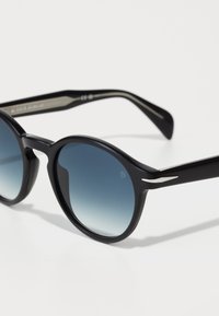 Black sunglasses with round lenses featuring a gradient blue tint. The frames are glossy, with silver accents along the temples.