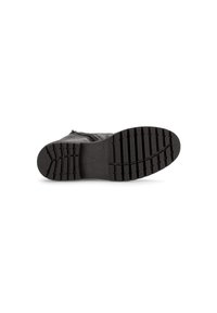 Botte noire avec une semelle en caoutchouc texturé présentant des rainures horizontales et verticales. La tige est en cuir lisse avec une fermeture éclair sur le côté.