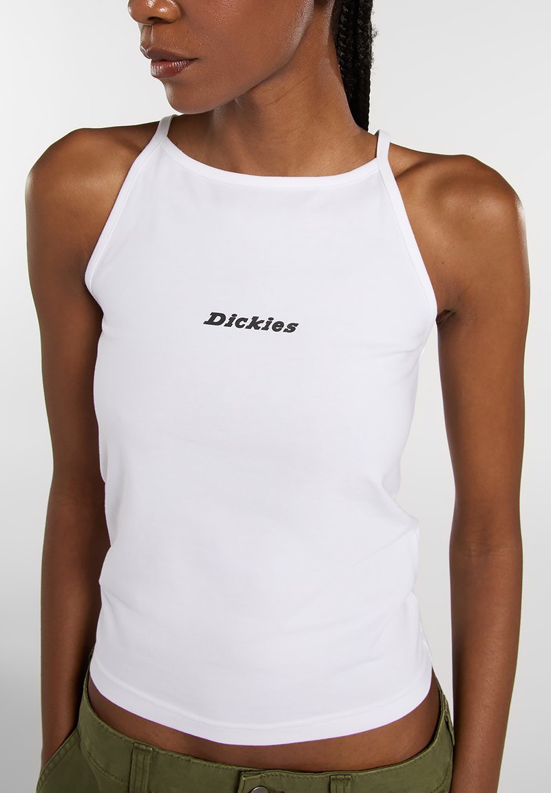 White sleeveless tank top featuring black "Dickies" logo at the chest, made from smooth fabric with a fitted design and straight neckline.