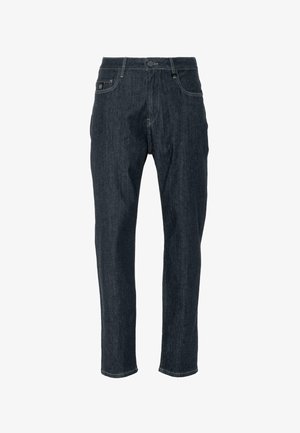 Tumedast sinisest denimpükstest, millel on sirge jalgade lõige, viis taskut, nööpkinnitus ja peened õmblustooted. Kitsas lõige siledusega.