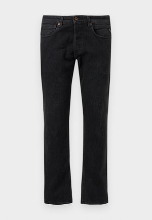 Black denim jeans with a straight leg design, featuring five pockets, subtle whiskering, and orange stitching accents.