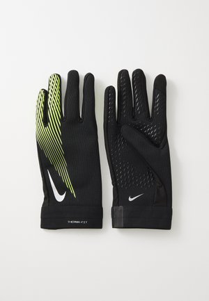 Gants thermiques noirs avec une prise texturée, présentant un motif de rayures vert fluo d'un côté et un logo au niveau du poignet.