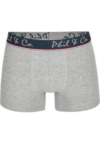 Boxers grises hechos de una tela suave, con una cinturilla azul marino que lleva el texto "Phil & Co." en un tono gris claro y detalles en rojo.