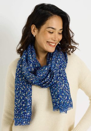 Pañuelo de color azul con estampado floral, confeccionado en tela ligera, con borde con flecos y diseños intrincados de hojas en tonos crema y turquesa.