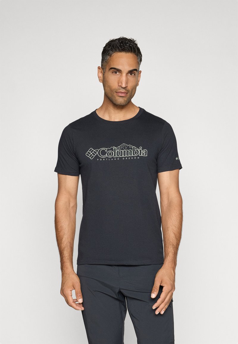 Schwarzes T-Shirt mit kurzen Ärmeln aus Baumwolle, mit einem grünen Columbia-Logo und Berggrafiken über der Brust. Klassischer Schnitt.