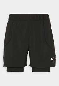 Mustat Puma-lyhythousut sisäänrakennetulla puristustasolla ja joustavalla vyötäröllä, etujalan Puma-logo.