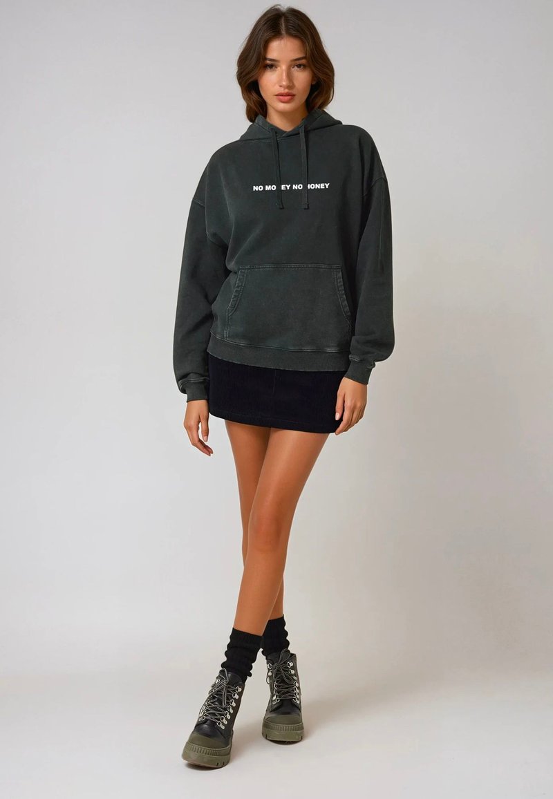 Dark gray hoodie with white text "NO MONEY NO HONEY," features a front pocket, loose fit, paired with a black corduroy mini skirt and black boots.