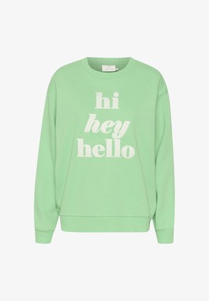 Lichtgroene oversized sweatshirt van zachte stof, met de tekst "hi hey hello" in het wit, en geribde manchetten en onderrand.