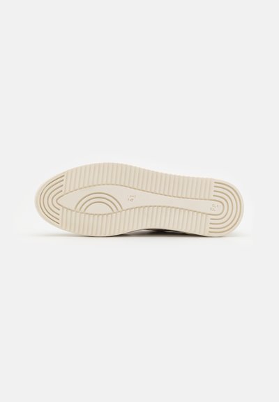 Cream-colored shoe sole with horizontal and curved grooves, size 41 marked in the center, isolated on white background.
