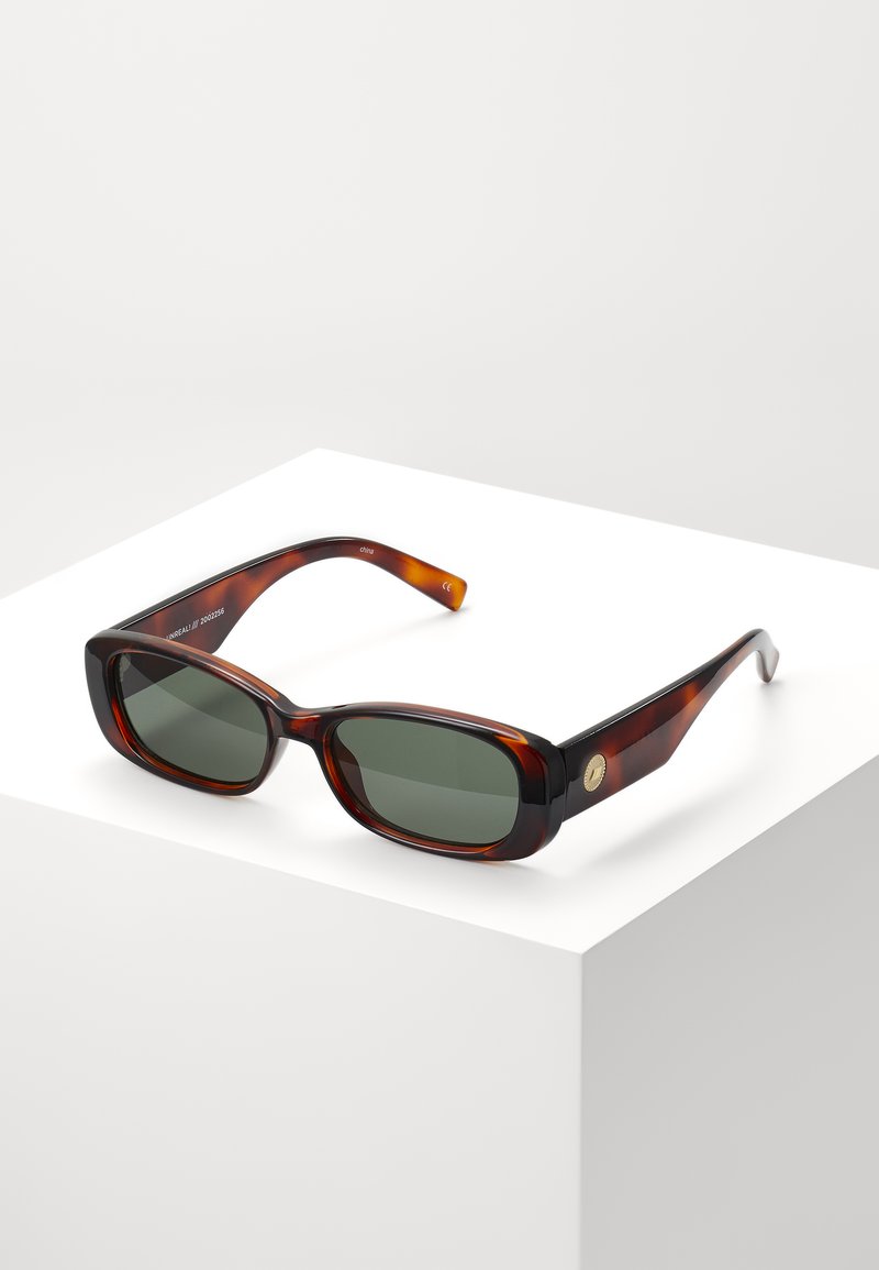 Tortoiseshell rectangular sunglasses with green lenses. Wide frame, smooth finish, gold accent on the side, and slim temples.