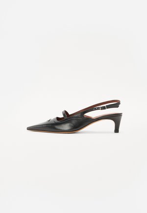 Black leather slingback shoe with pointed toe and a small heel. Features a cut-out design and a strap with a buckle for secure fit.