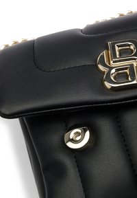 Black quilted leather handbag with a gold-tone logo and snap closure. Features a textured finish and accent chain detail.