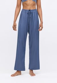 Blauwe satijnen pyjamabroek met een trekkoord in de taille, met een losse pasvorm en een soepele textuur, die tot de enkels reikt.