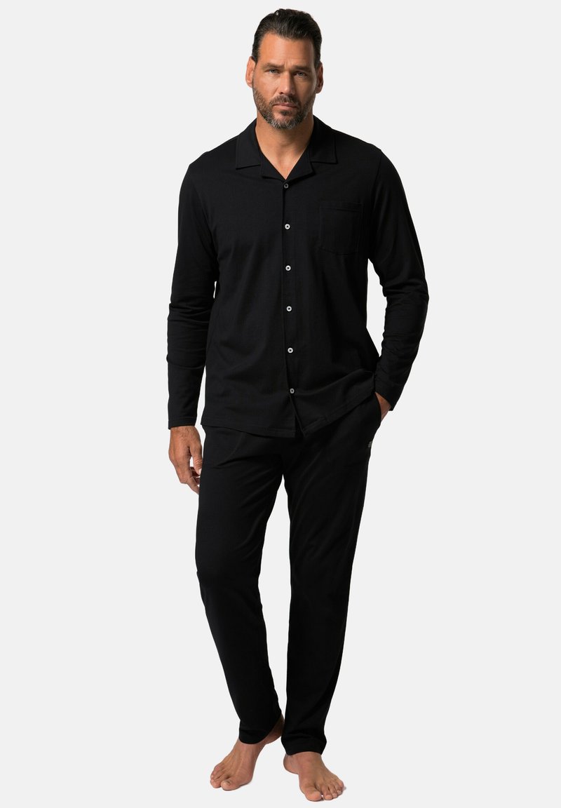Black pajamas set for men with long sleeves and pants. Soft fabric, button-up shirt with pocket detail, fitted design.