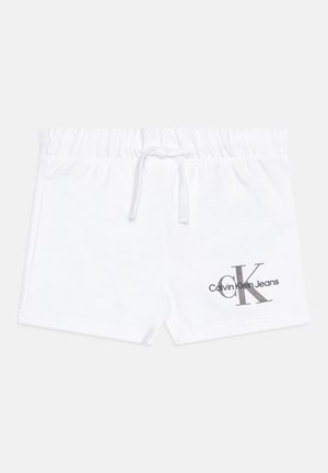 Baltos medvilnės šortai su elastingu juosmeniu, turintys raištelį ir pilkai atspaustą logotipą, kuriame užrašyta "Calvin Klein Jeans."