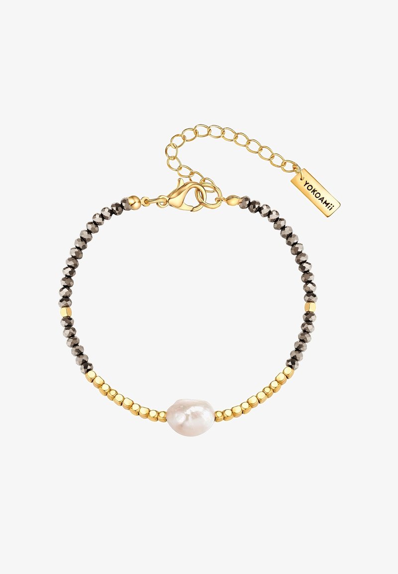 Zelta tonisks rokassprādze ar apaļām melnām pērlēm, zelta metāla akcentiem, centrālo neregulāru baltu pērli un omā ar zīmogu.