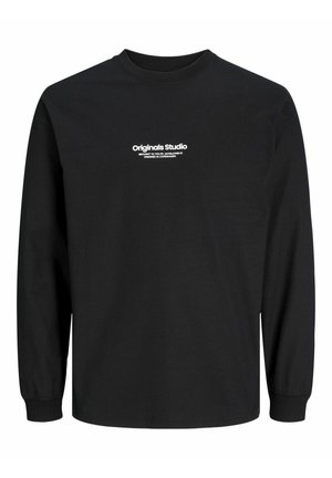 Tricou negru cu mânecă lungă, fabricat din bumbac. Dispune de un gât rotund și inscripții albe. Croială lejeră cu manșete ribbate.