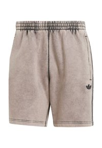 Light beige athletic shorts with a soft texture, elastic waistband, side pockets, and black accents. Features subtle logo on the left side.