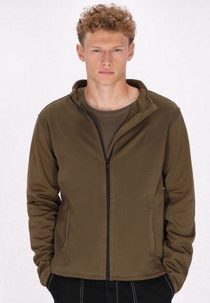 Olivgrüne Zip-Jacke aus weichem Material, mit Stehkragen, Seitentaschen und kontrastierendem schwarzen Reißverschluss. Insgesamt glatte Struktur.