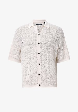 Korte mouw, knoop-up cardigan in crème met een kanten breipatroon, voorzien van een kraag en zwarte knopen voor contrast.