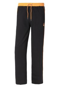 Schwarze Jogginghosen mit einem elastischen Bund und orangefarbenem Kordelzug. Mit orangefarbenen Seitestreifen und einem kleinen Logo auf der Vorderseite.