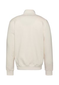 Kremowy sweatshirt z prążkowanym kołnierzem, mankietami i dolnym obszyciem. Miękki, strukturalny materiał oraz luźny krój bez widocznych logo.