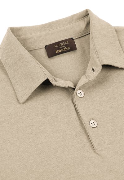 Beige cotton polo shirt collar with two buttons and a brown label reading "SLOWEAR ZANONE icecotton" inside the neckline.