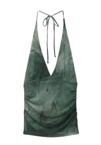 Green halter neck top made from soft fabric, featuring a deep V-neck, ruched detailing on the sides, and a tie closure at the back.