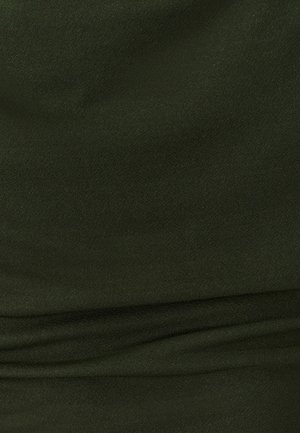 Green, stretchy fabric with a smooth texture and subtle sheen, featuring gathered details along the midsection.