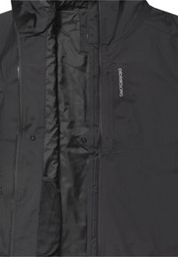 Chaqueta negra Didriksons con cremallera frontal abierta y cierre de botones, mostrando un forro interior liso y un bolsillo de malla.