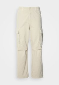 Tommy Jeans AIDEN BAGGY - Cargo trousers - beige