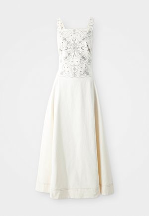 Robe en coton blanc avec un design brodé sur le buste. Dotée de bretelles réglables et d'une jupe évasée. Texture lisse et détails subtils.