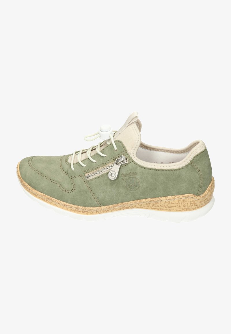 Green suede sneaker with cream accents, featuring a side zipper and elastic laces, mounted on a textured cork and white rubber sole.