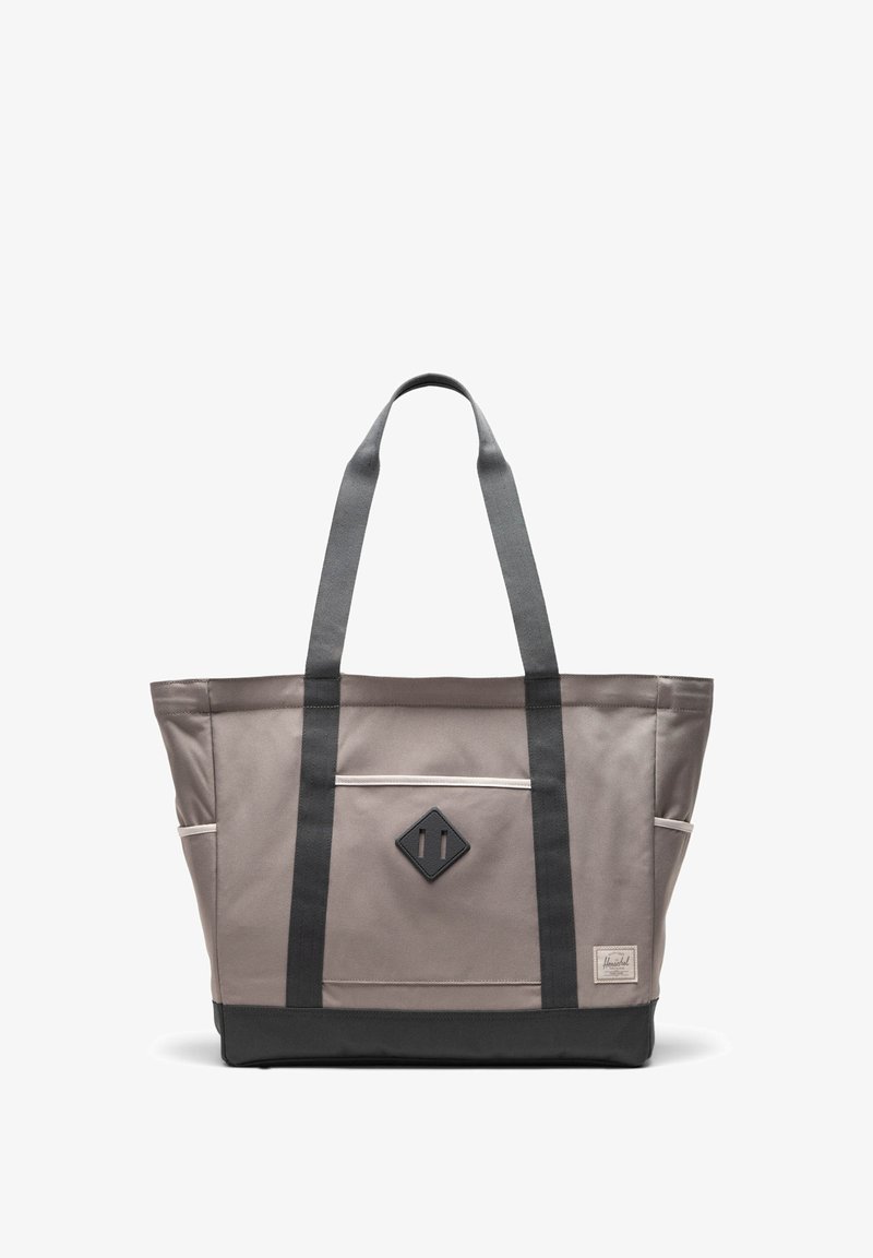 Gray tote bag with black accents, featuring two sturdy straps, a front pocket with a diamond logo, and a contrasting black base.