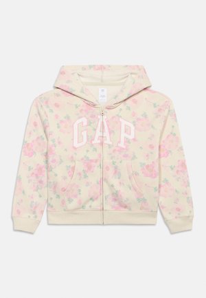 Φούτερ με φερμουάρ σε κρεμ χρώμα με ροζ floral σχέδιο και μεγάλα λευκά και ροζ γράμματα "GAP" μπροστά, με μπροστινές τσέπες και κουκούλα.