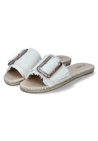 White fabric slide sandals featuring frayed edges, a large square buckle with a marbled finish, and a woven jute sole.