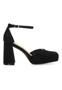 Tacones de plataforma de terciopelo negro con punta redonda, tacón grueso y correa para el tobillo ajustable. Textura suave y diseño minimalista.