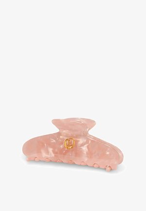 Pink marbled plastic hair claw clip with gold circular logo on white background.