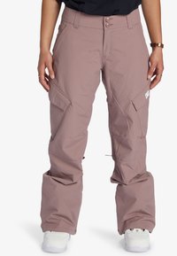 Helle rosa wasserdichte Snowboardhosen mit entspannter Passform, zwei Seitentaschen und Logodetail am rechten Oberschenkel. Verstellbare Bündchen.