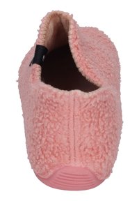 Soft pink fuzzy slipper with textured rubber sole and open back viewed from the top front.