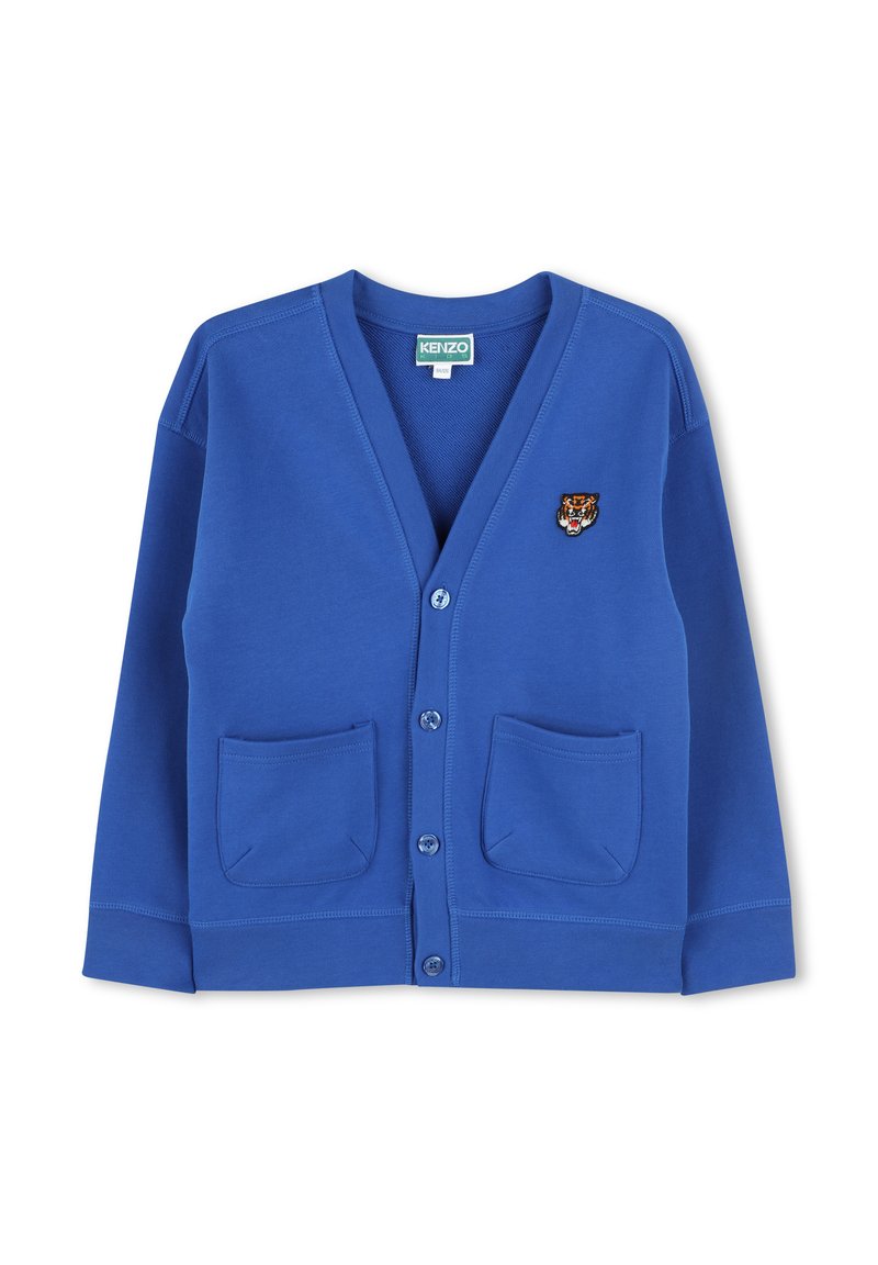 Blue cardigan with a v-neck, button closure, and two front pockets. Features an embroidered tiger logo on the left chest. Soft fabric texture.