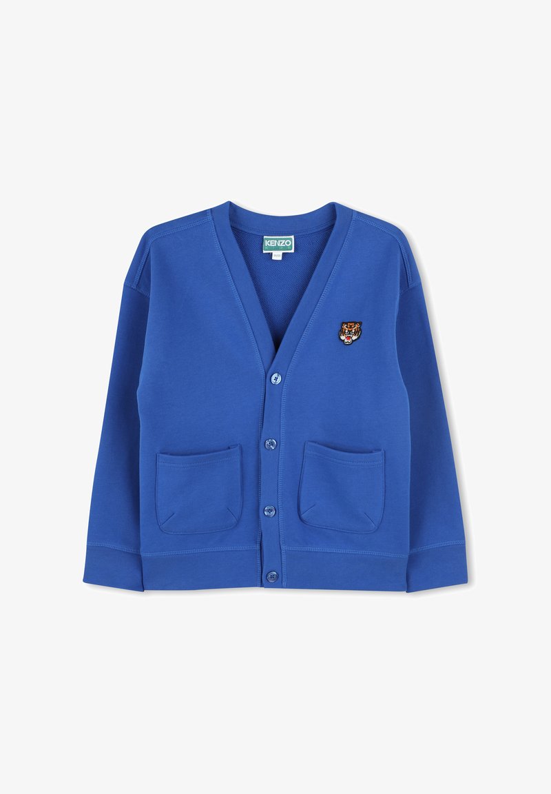 Blue cardigan with a v-neck, button closure, and two front pockets. Features an embroidered tiger logo on the left chest. Soft fabric texture.