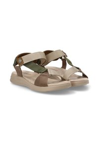 Sandalias marrones y beige con tiras cruzadas, detalles verdes y una suela acolchada. El material parece ser tela tejida y goma.