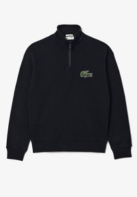 Zwarte fleece pullover met een kwart-ritssluiting en een opstaande kraag. Voorzien van een groen geborduurd krokodillenlogo op de linkerborst. Zachte textuur.